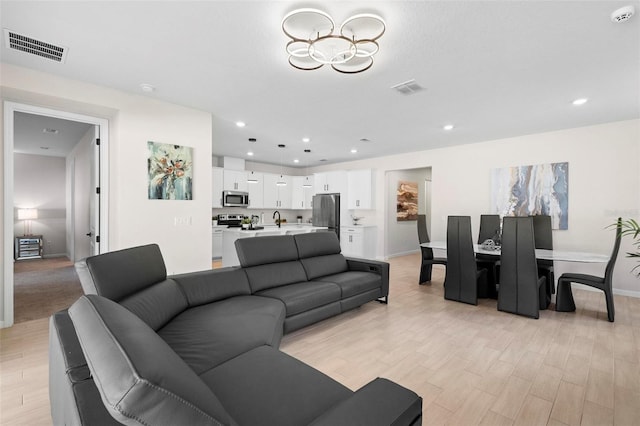 living room with light hardwood / wood-style floors