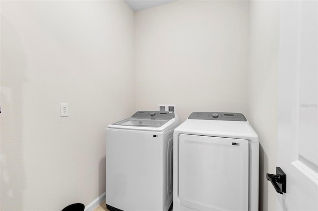 laundry room with washer and clothes dryer