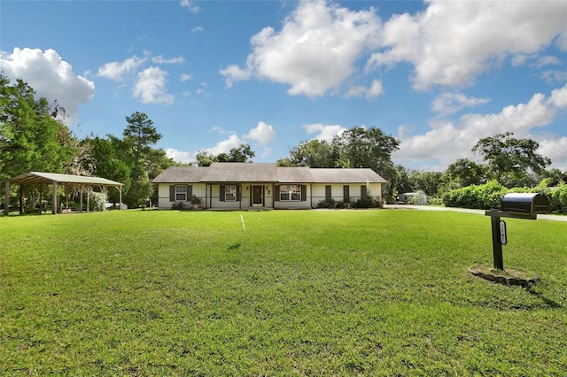 single story home featuring a front yard and a detached carport