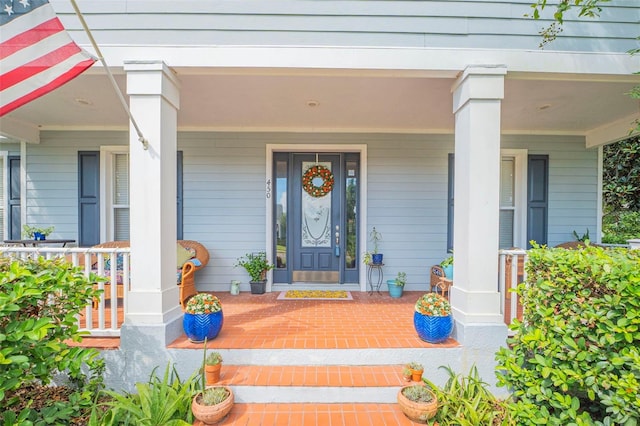 property entrance with covered porch