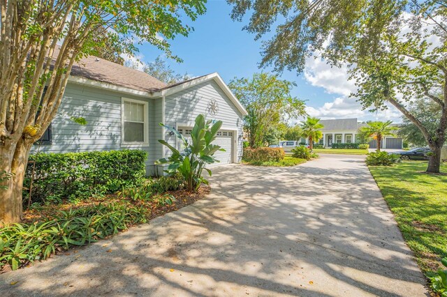 view of side of home with a garage