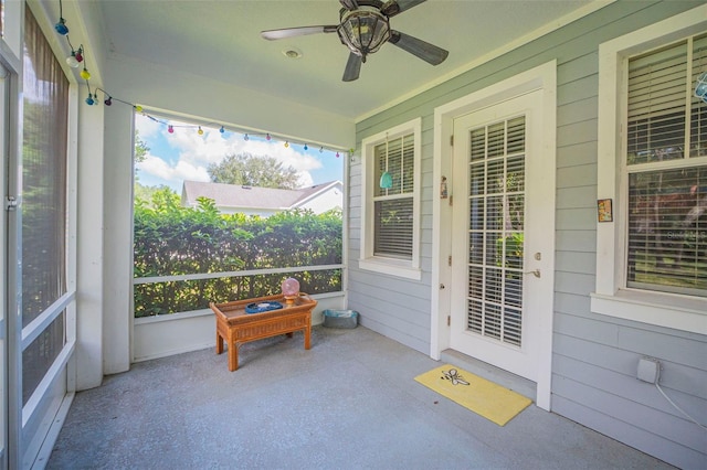 sunroom featuring ceiling fan