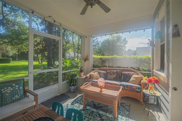 sunroom featuring ceiling fan