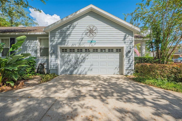 view of side of home with a garage