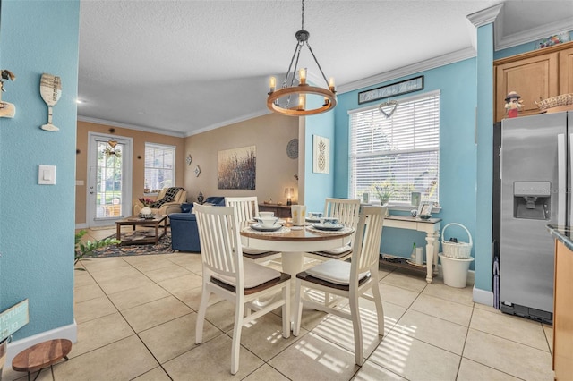 dining room featuring a chandelier, a textured ceiling, light tile patterned floors, and crown molding