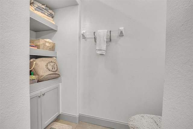 bathroom with tile patterned floors