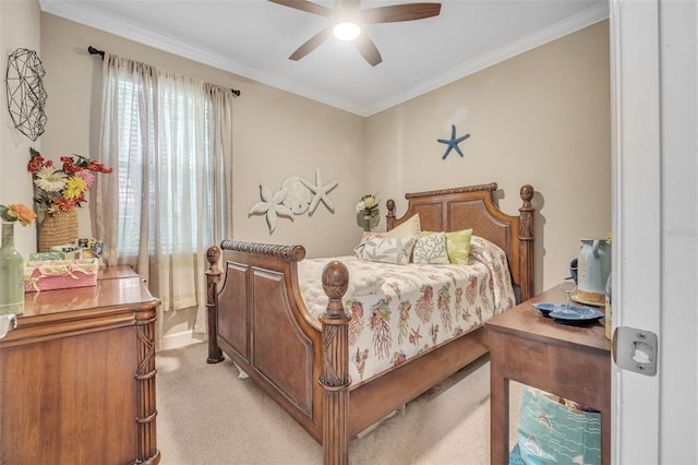 bedroom with ornamental molding, ceiling fan, and light colored carpet