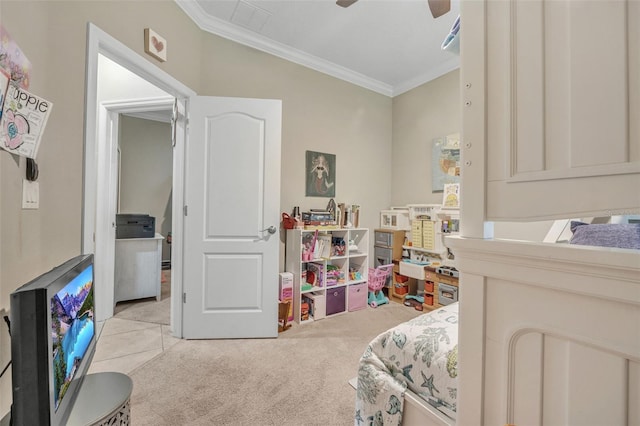 bedroom with ornamental molding, ceiling fan, and light colored carpet