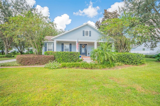 view of front of house featuring a front yard and covered porch