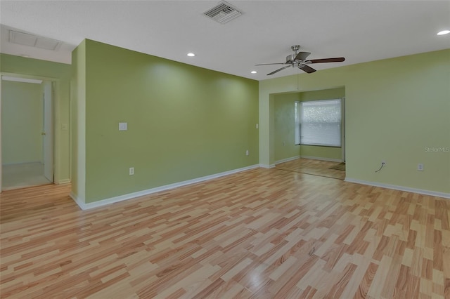 unfurnished room with ceiling fan and light hardwood / wood-style flooring