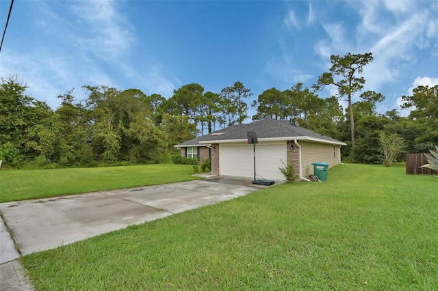 view of side of property featuring a garage and a yard