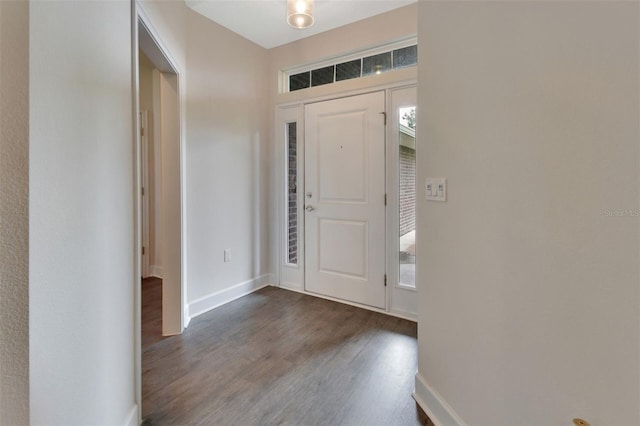 entryway with dark wood-type flooring