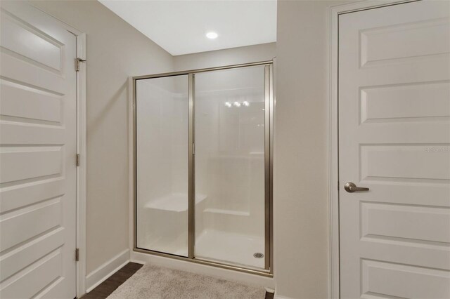 bathroom featuring an enclosed shower