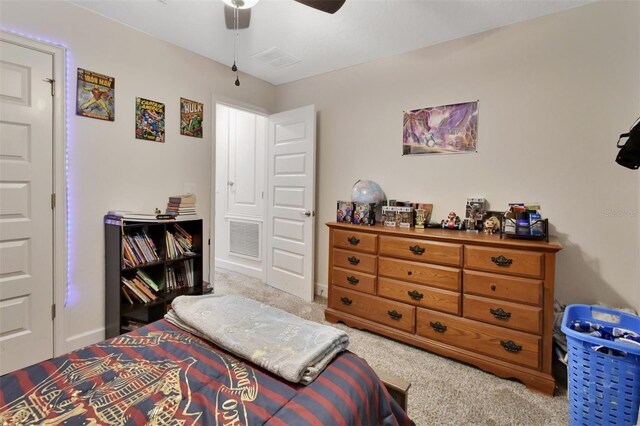 carpeted bedroom featuring ceiling fan