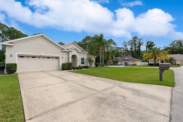 view of front of property with a garage and a front lawn