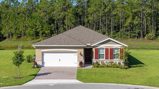 view of front facade featuring a garage and a front lawn