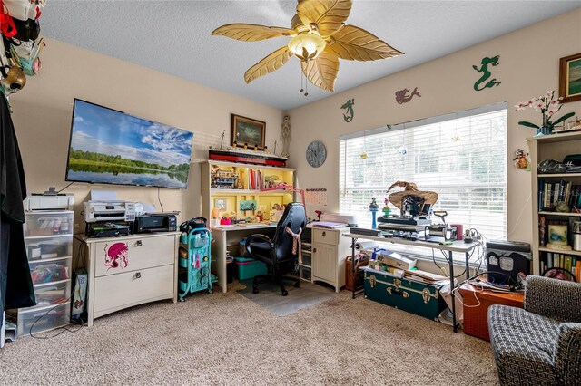 office area with light carpet, a textured ceiling, and ceiling fan