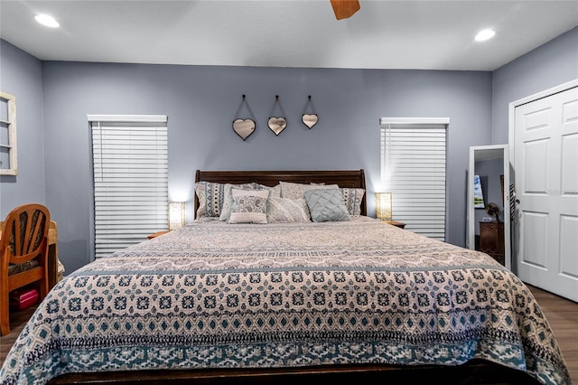 bedroom with wood-type flooring and ceiling fan