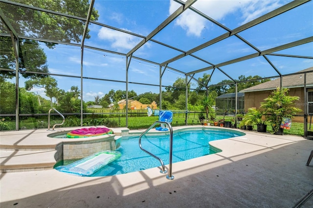 view of swimming pool with a hot tub, a patio, and glass enclosure