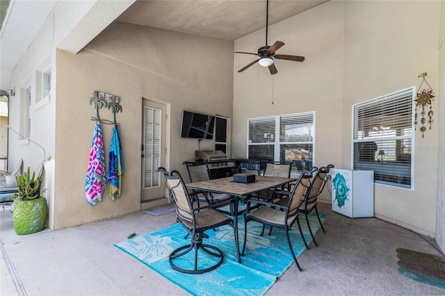 view of patio featuring ceiling fan