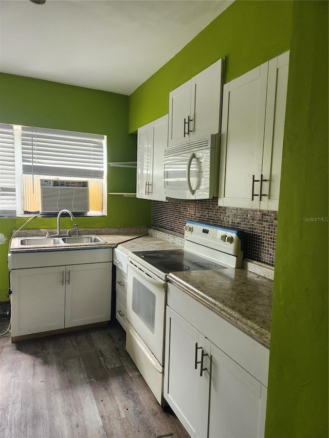 kitchen featuring white cabinetry, white appliances, dark hardwood / wood-style flooring, and tasteful backsplash