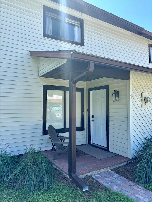 doorway to property with a porch