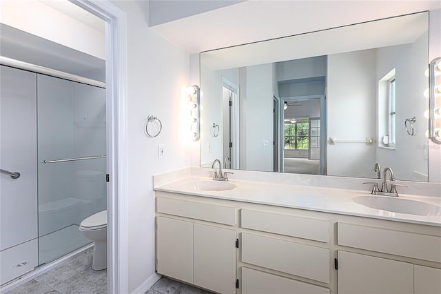 bathroom with toilet, tile patterned floors, walk in shower, and double vanity