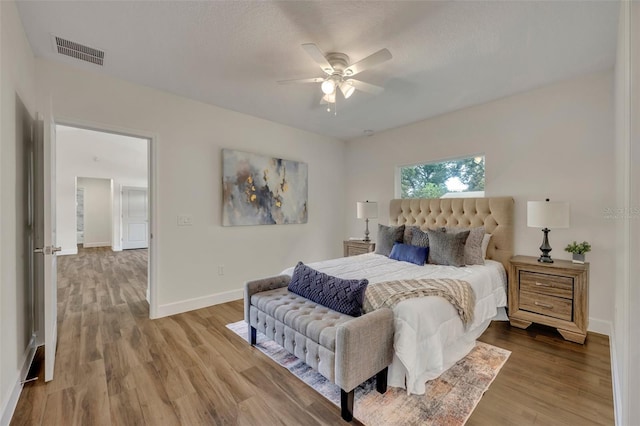 bedroom featuring wood-type flooring and ceiling fan