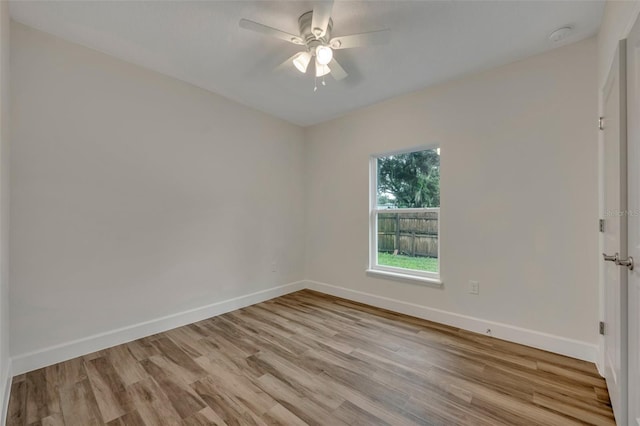 unfurnished room featuring light wood-type flooring and ceiling fan