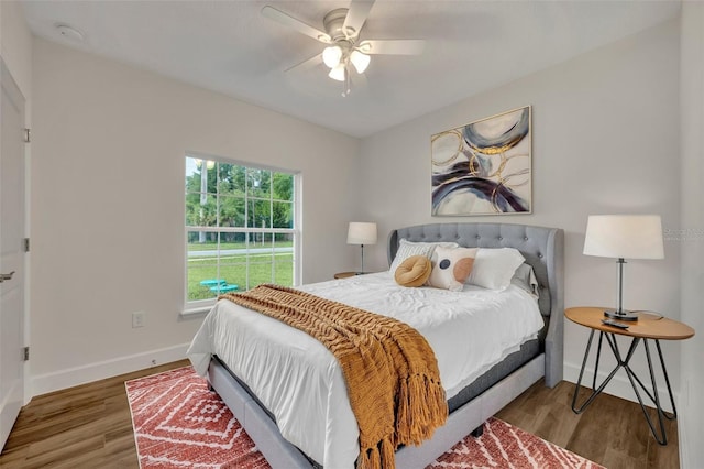 bedroom with ceiling fan and hardwood / wood-style floors