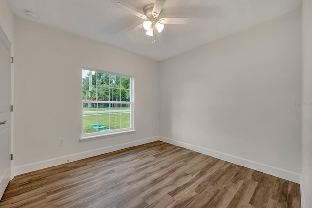 spare room with ceiling fan and hardwood / wood-style floors