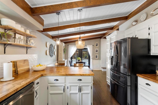 kitchen with white cabinets, stainless steel dishwasher, hanging light fixtures, black fridge with ice dispenser, and butcher block countertops