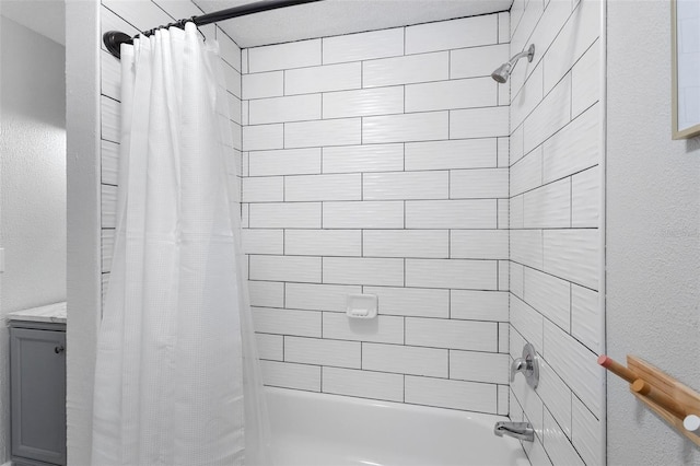 bathroom with vanity and shower / tub combo