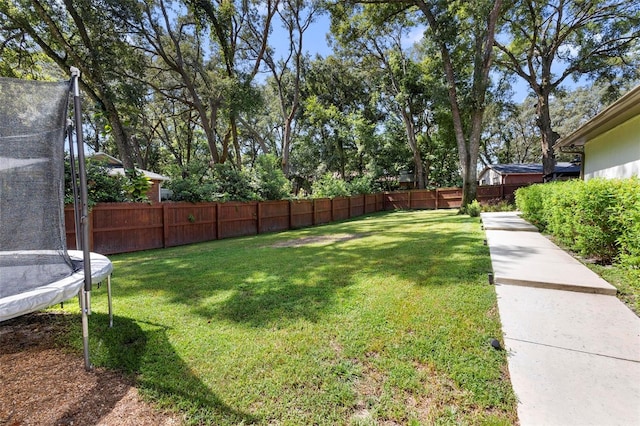 view of yard with a trampoline