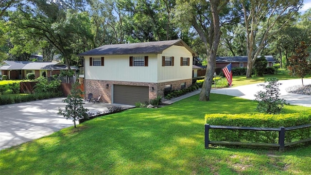 split level home featuring a garage and a front yard