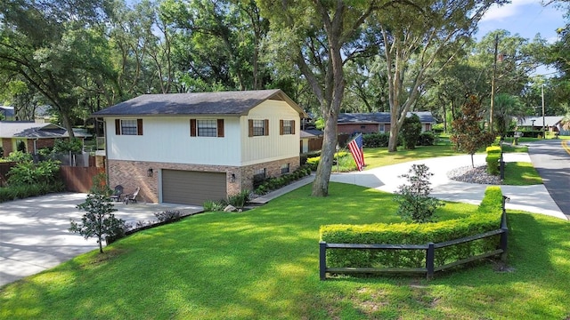 view of front of house featuring a garage and a front lawn