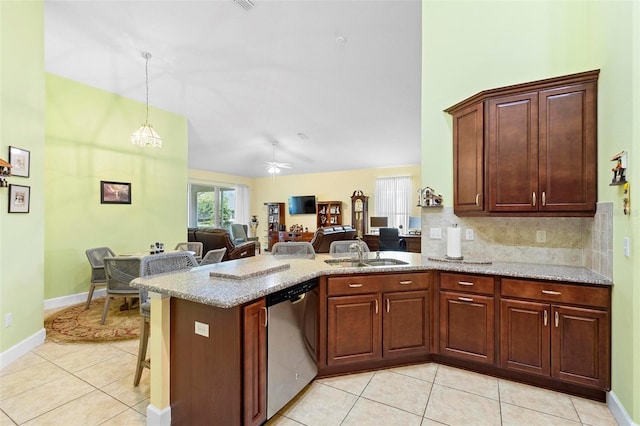 kitchen with light tile patterned flooring, a peninsula, a sink, stainless steel dishwasher, and backsplash