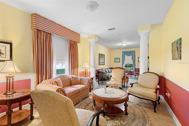 living room featuring ornate columns