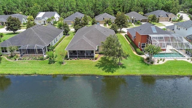 bird's eye view featuring a water view and a residential view