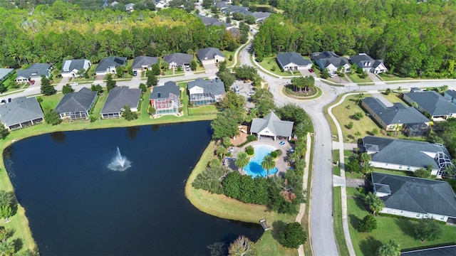 birds eye view of property featuring a water view and a residential view