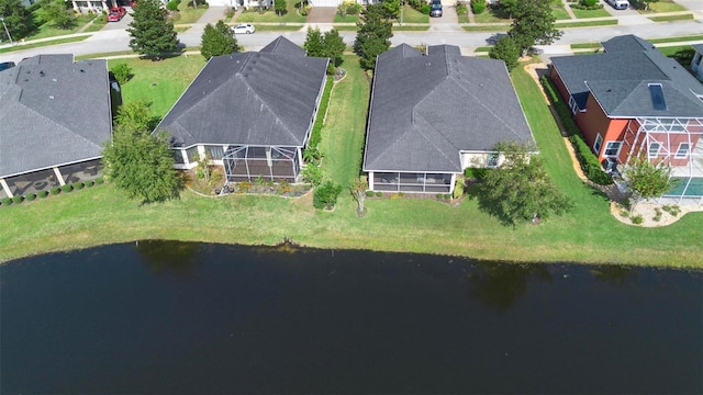 birds eye view of property featuring a residential view and a water view