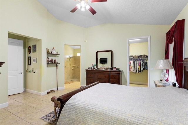 309 Chesham St, Ormond Beach, FL 32174 - tiled bedroom with lofted ceiling, a walk in closet, baseboards, connected bathroom, and a ceiling fan