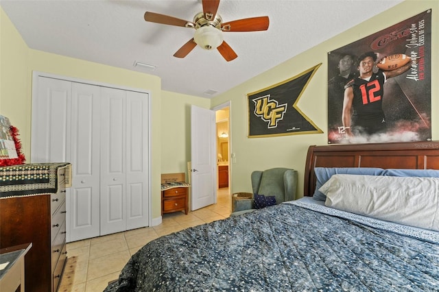 309 Chesham St, Ormond Beach, FL 32174 - bedroom featuring light tile patterned floors, a closet, and a ceiling fan