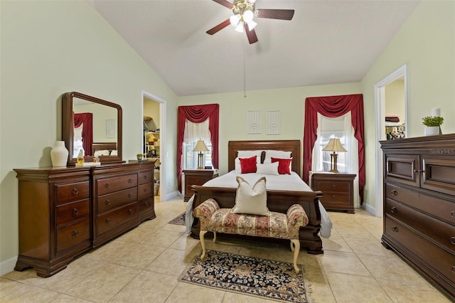 309 Chesham St, Ormond Beach, FL 32174 - bedroom featuring vaulted ceiling, light tile patterned flooring, baseboards, ceiling fan, and a textured ceiling