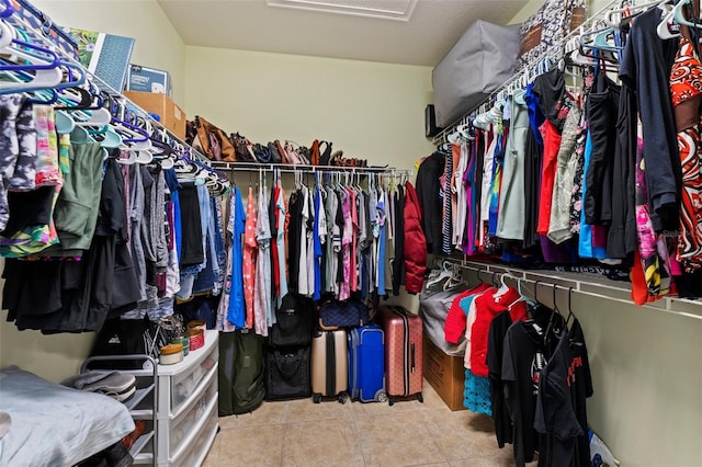 309 Chesham St, Ormond Beach, FL 32174 - walk in closet with tile patterned floors and attic access