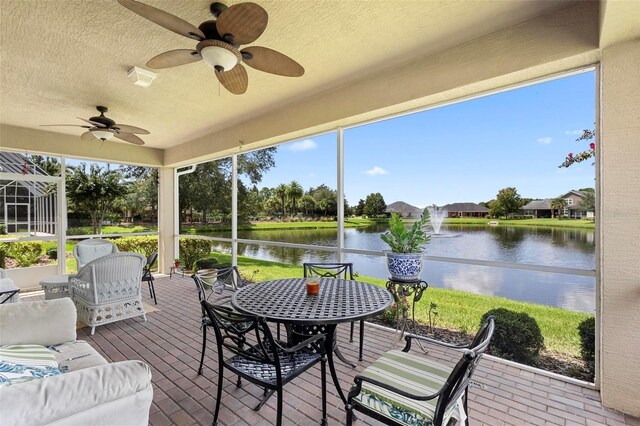309 Chesham St, Ormond Beach, FL 32174 - sunroom with a water view, a ceiling fan, and plenty of natural light
