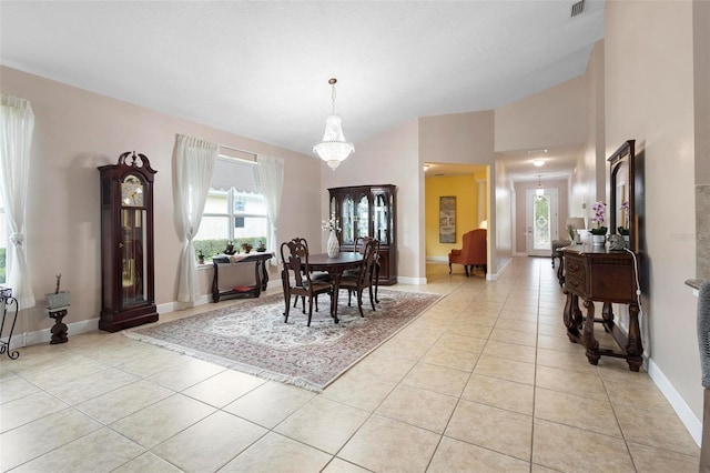 309 Chesham St, Ormond Beach, FL 32174 - dining space with light tile patterned floors and baseboards