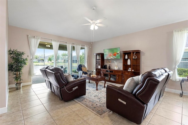 309 Chesham St, Ormond Beach, FL 32174 - living area featuring ceiling fan, baseboards, and light tile patterned floors