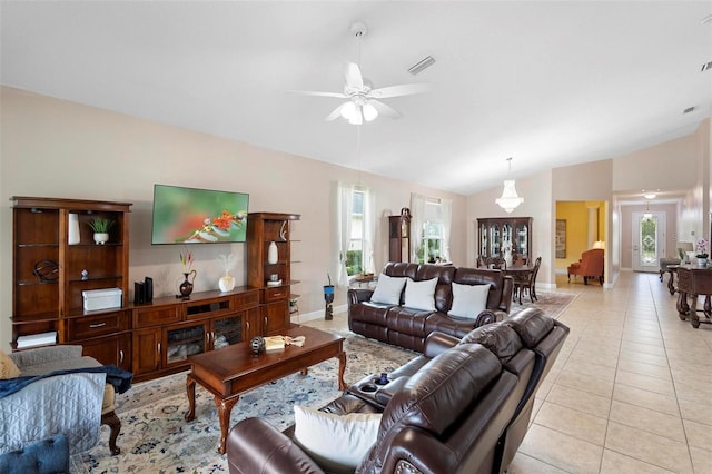 309 Chesham St, Ormond Beach, FL 32174 - living room with lofted ceiling, ceiling fan, plenty of natural light, light tile patterned floors, and baseboards