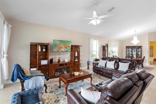 309 Chesham St, Ormond Beach, FL 32174 - living area with lofted ceiling, light tile patterned floors, ceiling fan, and baseboards